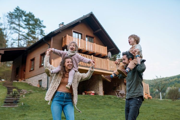 family in front of home